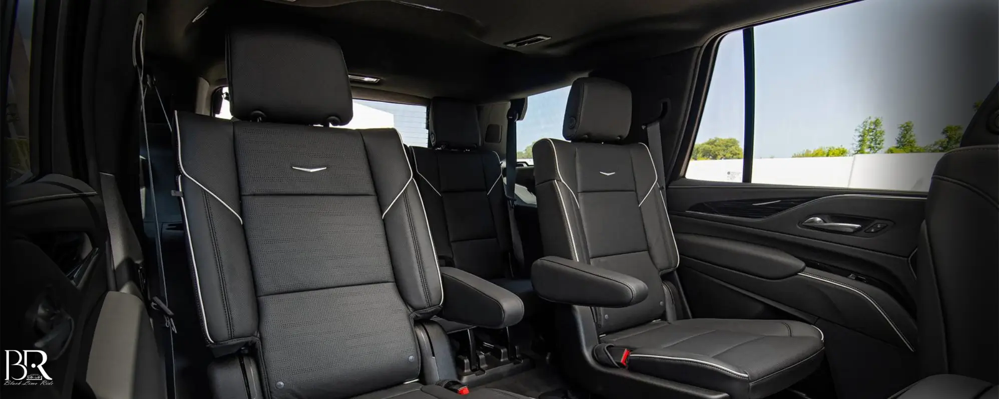 6-seater-black-cadillac-escalade-interior-passenger.webp